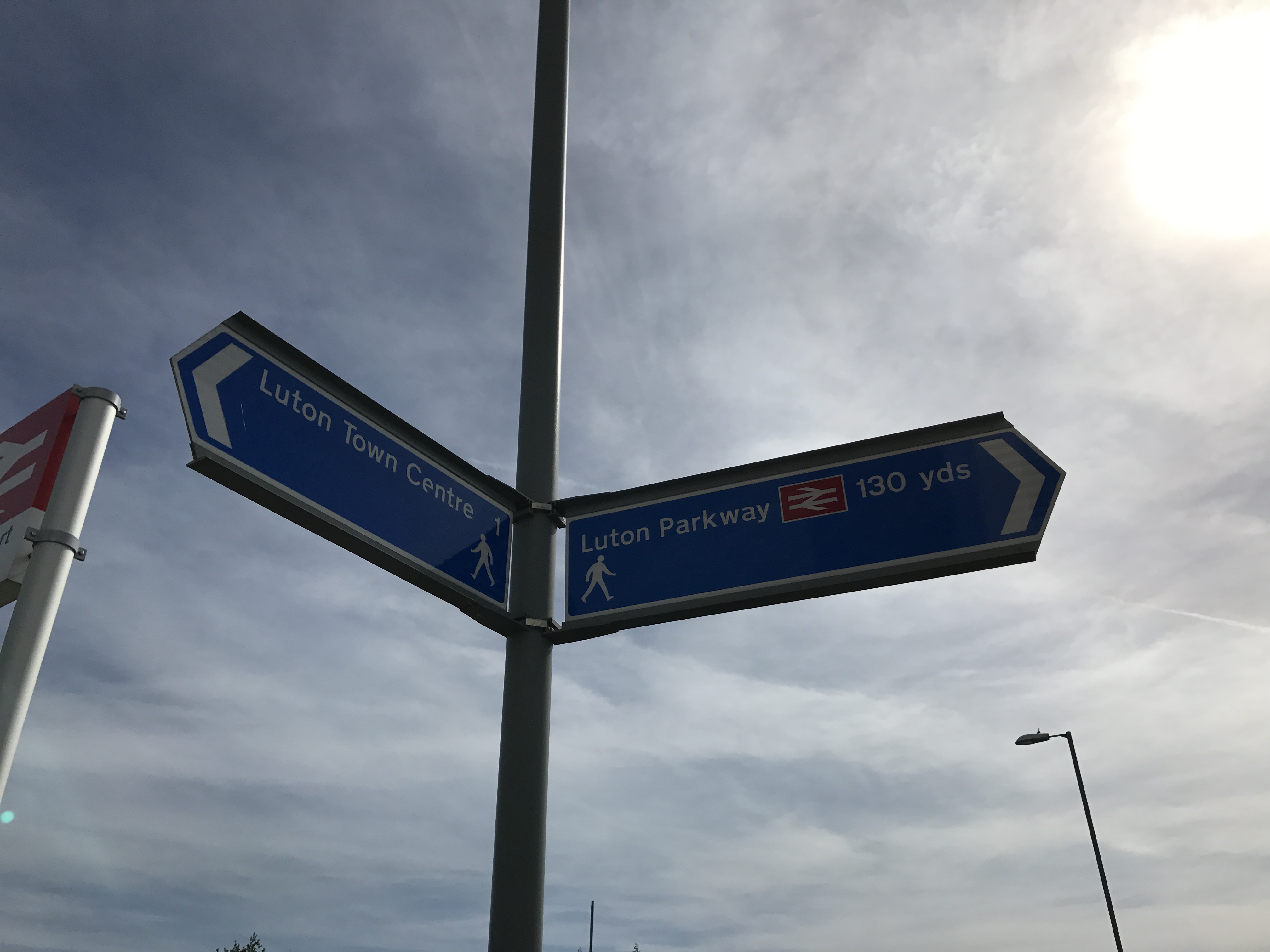 Luton town centre and Luton Parkway sign The Lutonian